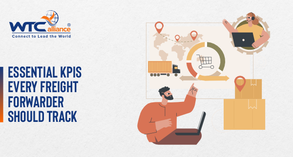The illustration depicts a logistics professional working on a laptop while monitoring freight operations, including a cargo truck, location pins on a world map, e-commerce shopping cart icon, and shipping boxes—representing key performance indicators for freight forwarding businesses.